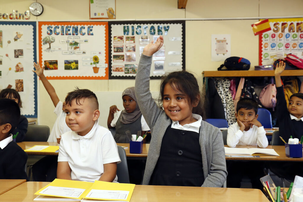 The class are engaged in the lesson of the day