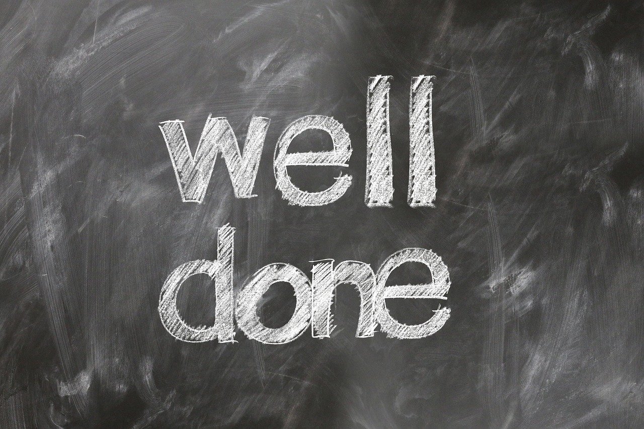 Well done written on a chalk board